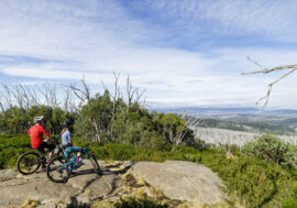 Two cyclists enjoying the view at Lake Mountain Bike Park